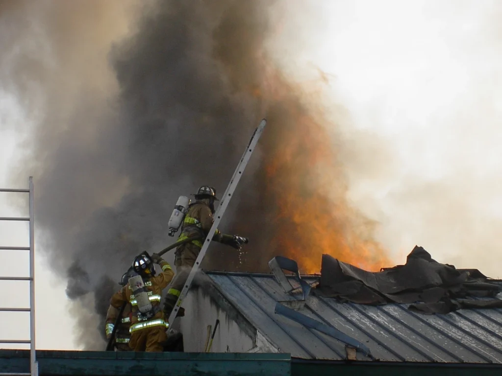 elect mark jones firefighters on roof photo